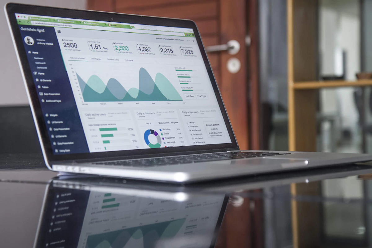 Financial charts on a laptop representing a Wealthsimple Tax review and online tax filing software in Canada